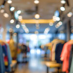 pngtree clothing store in shopping mall boutique shop interior blur defocused background image 15650933